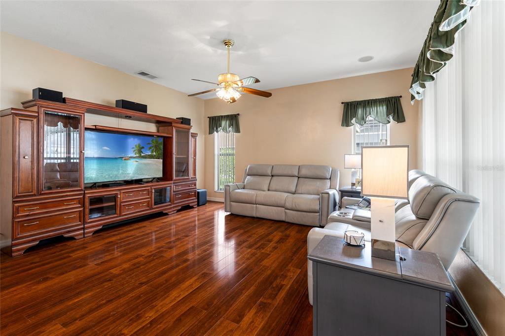 28390 Openfield Loop Wesley Chapel, FL 33543 - Photo 17 of 44 a living room with furniture and a flat screen tv