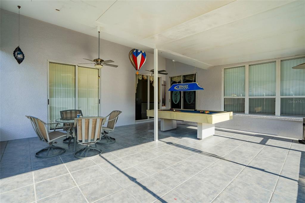 28390 Openfield Loop Wesley Chapel, FL 33543 - Photo 24 of 44 a dining room with furniture and a window