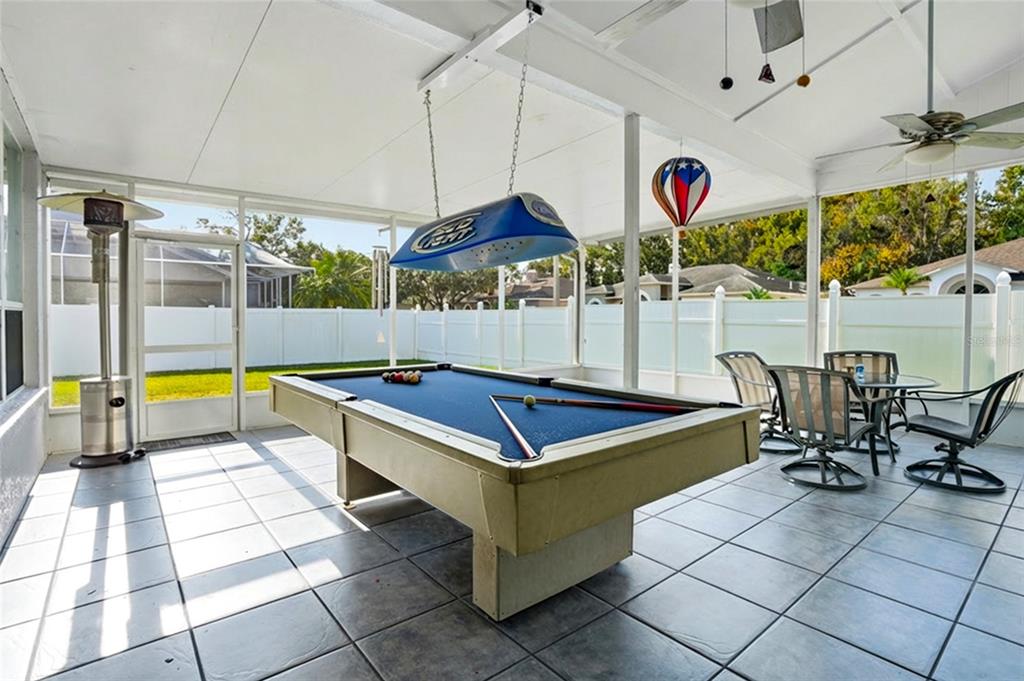 28390 Openfield Loop Wesley Chapel, FL 33543 - Photo 25 of 44 a room with musical instruments pool table and chairs