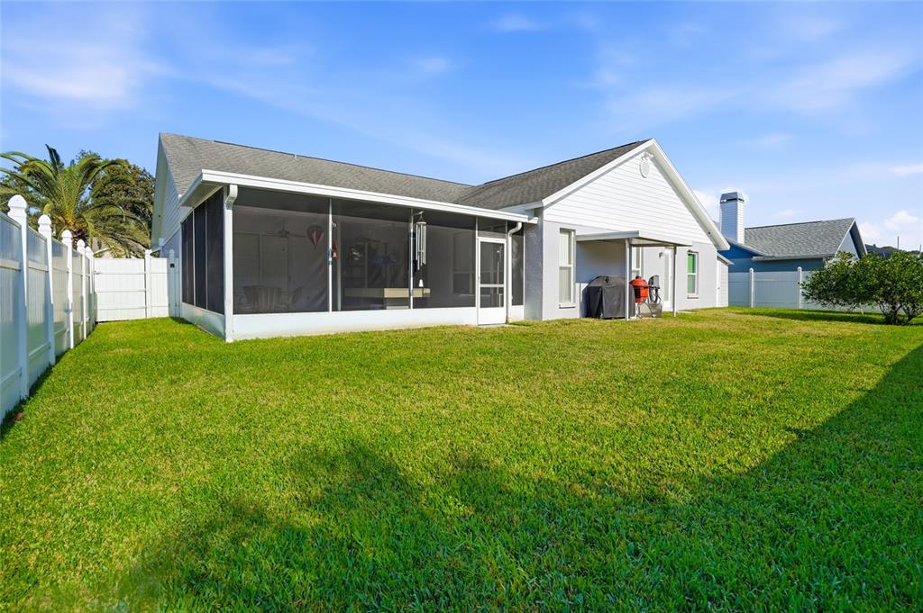 28390 Openfield Loop Wesley Chapel, FL 33543 - Photo 27 of 44 a view of a house with a yard and potted plants