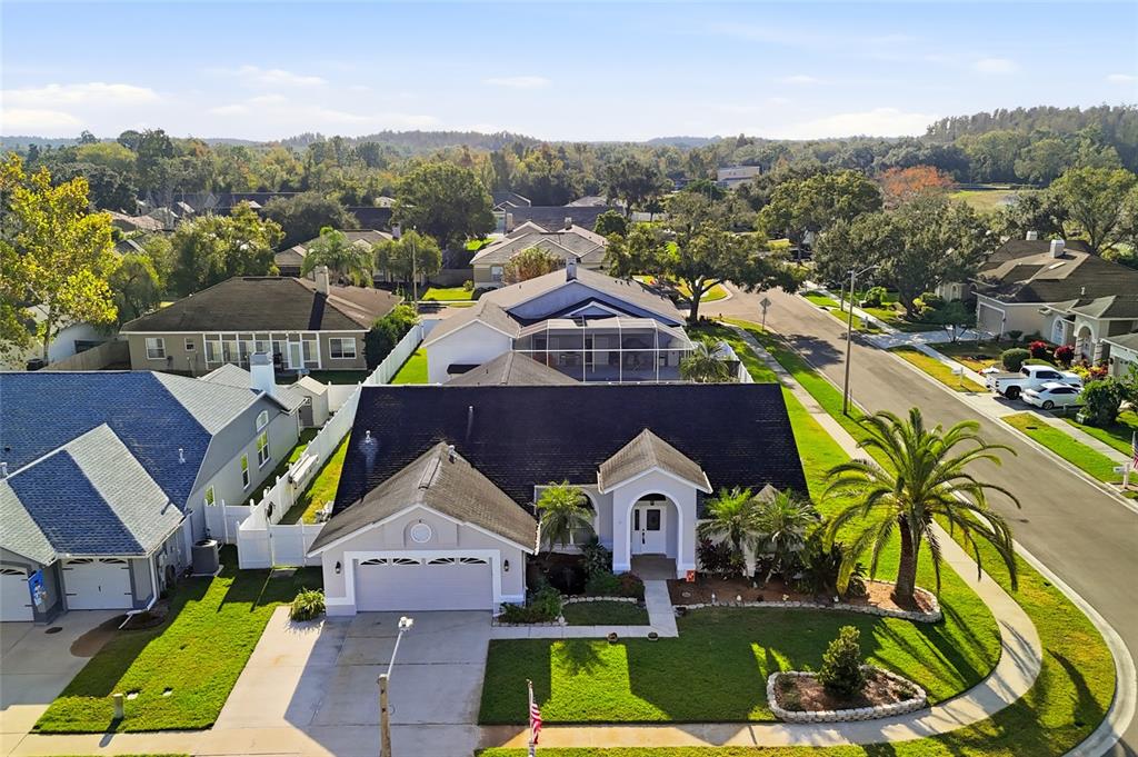 28390 Openfield Loop Wesley Chapel, FL 33543 - Photo 31 of 44 an aerial view of multiple houses with a big yard