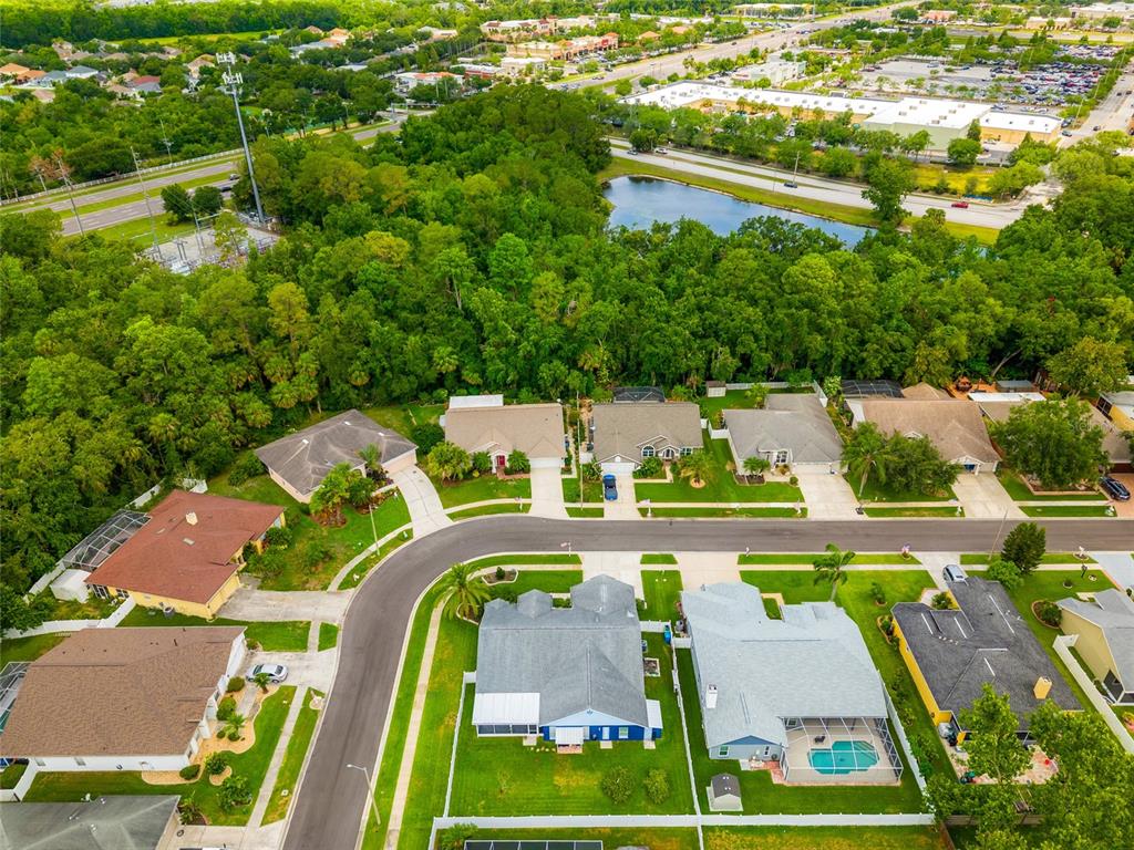 28390 Openfield Loop Wesley Chapel, FL 33543 - Photo 34 of 44 an aerial view of a pool patio fire pit and outdoor seating