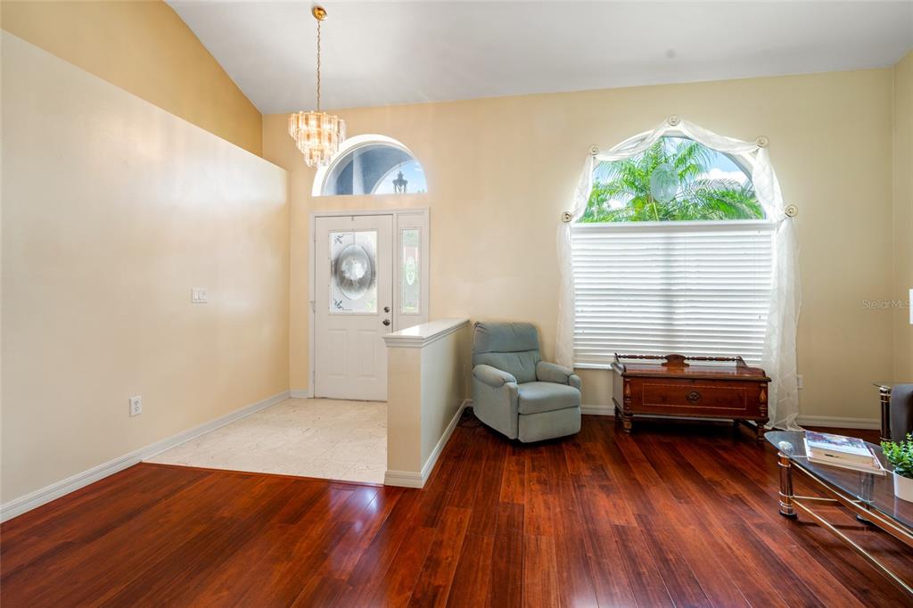 28390 Openfield Loop Wesley Chapel, FL 33543 - Photo 4 of 44 a living room with furniture and a wooden floor