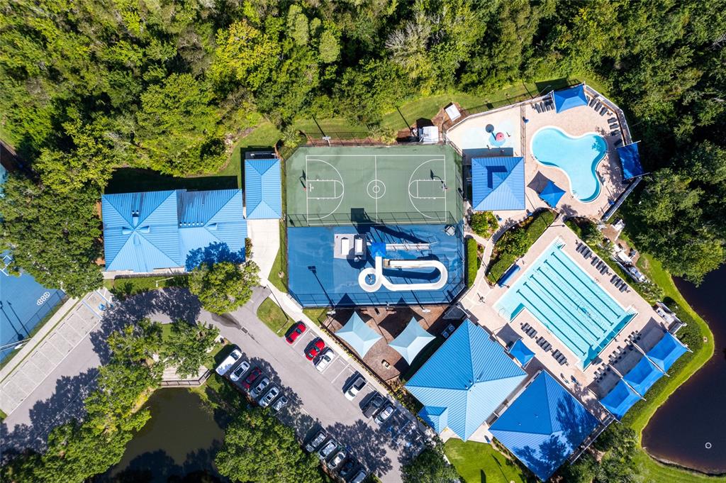 28390 Openfield Loop Wesley Chapel, FL 33543 - Photo 44 of 44 an aerial view of a house with a swimming pool patio and outdoor seating