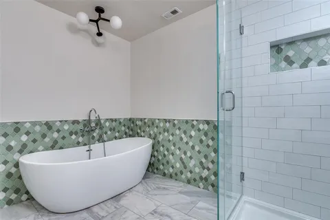 a white tub sitting in a bathroom