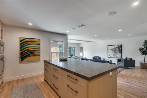 a kitchen with sink and center island