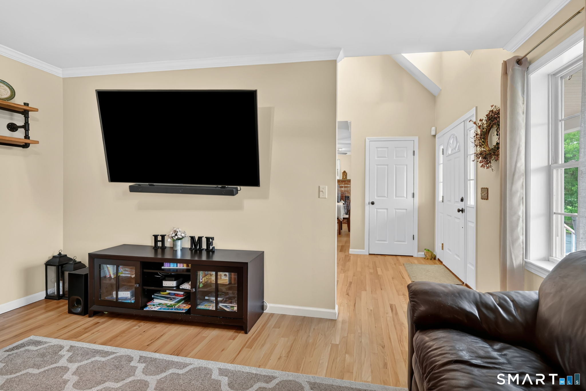 5 Tuckers Run Ledyard, CT 06339 - Photo 11 of 39 a living room with furniture and a flat screen tv