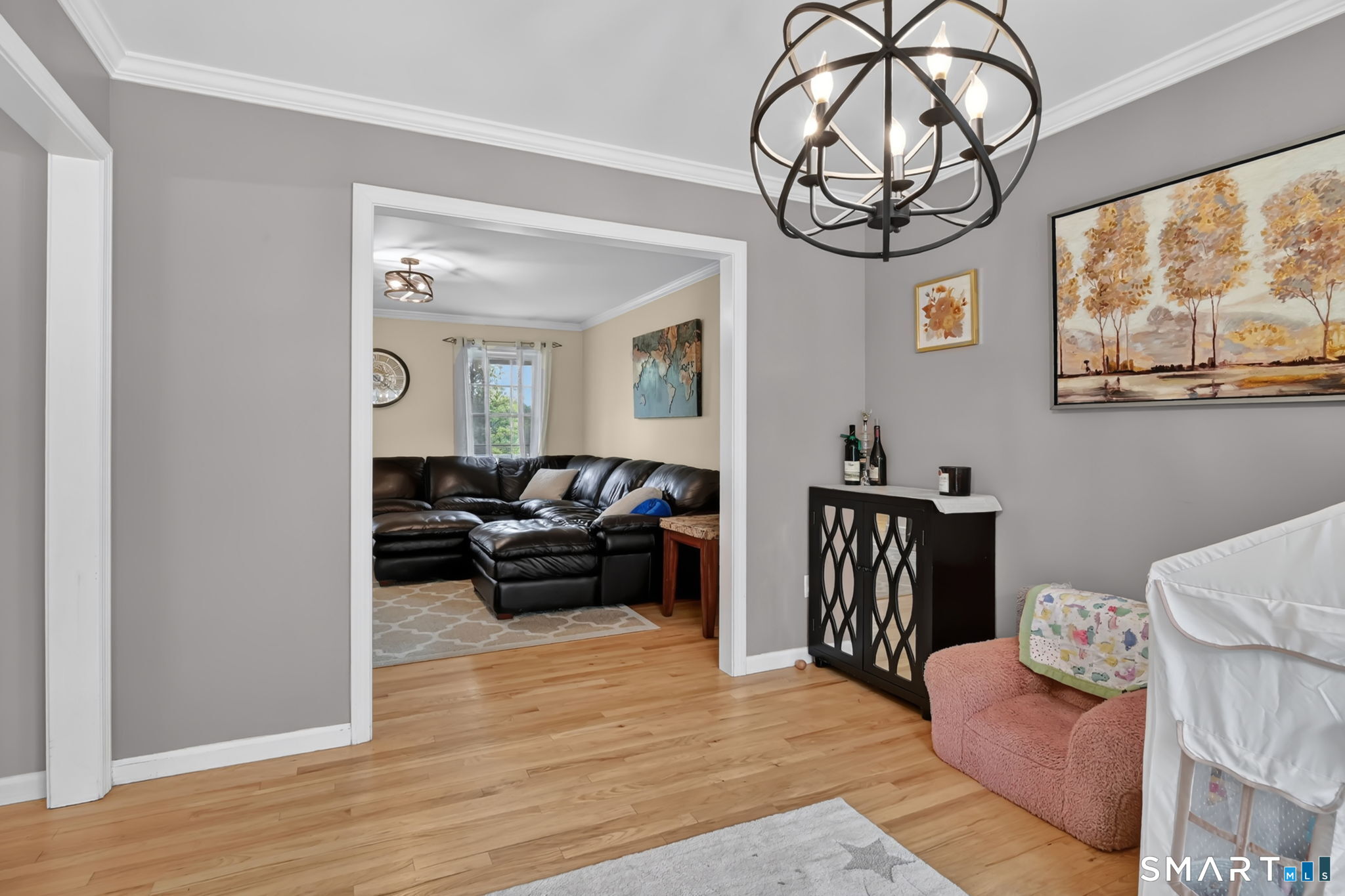 5 Tuckers Run Ledyard, CT 06339 - Photo 13 of 39 a living room with furniture a chandelier and a window
