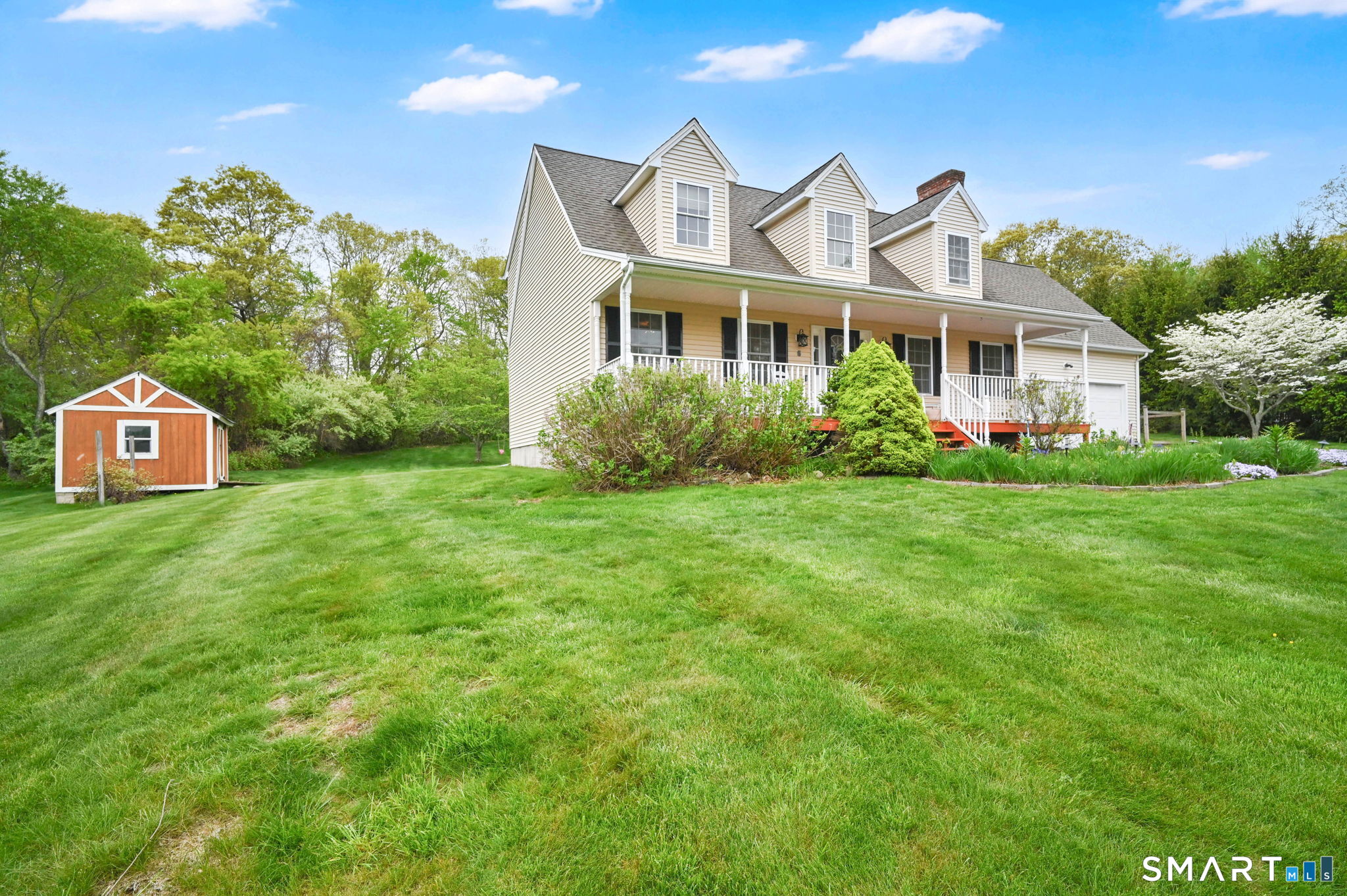 5 Tuckers Run Ledyard, CT 06339 - Photo 2 of 39 a front view of a house with a garden