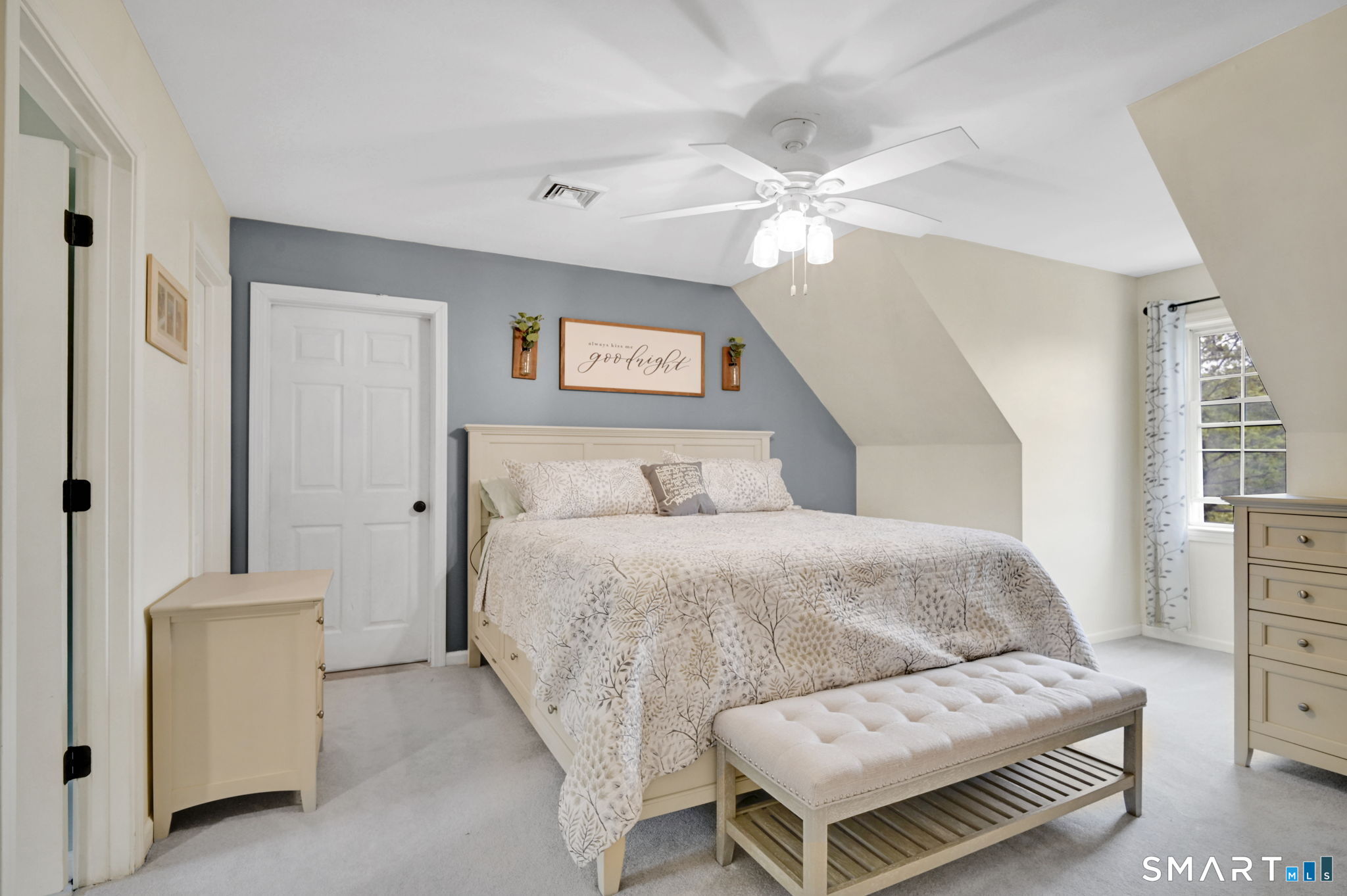 5 Tuckers Run Ledyard, CT 06339 - Photo 23 of 39 a bedroom with a bed and a chandelier