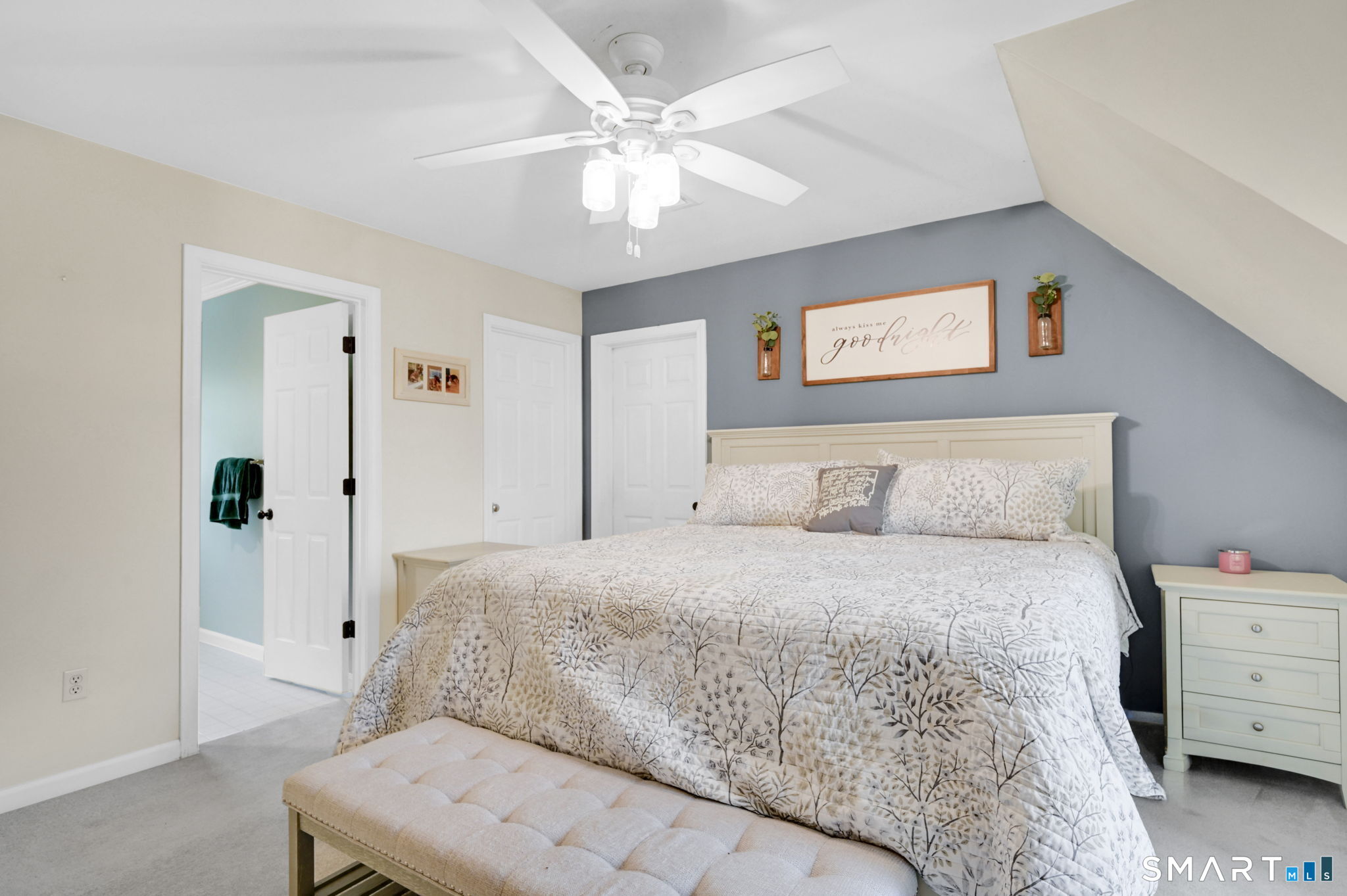 5 Tuckers Run Ledyard, CT 06339 - Photo 24 of 39 a bedroom with a bed and a chandelier
