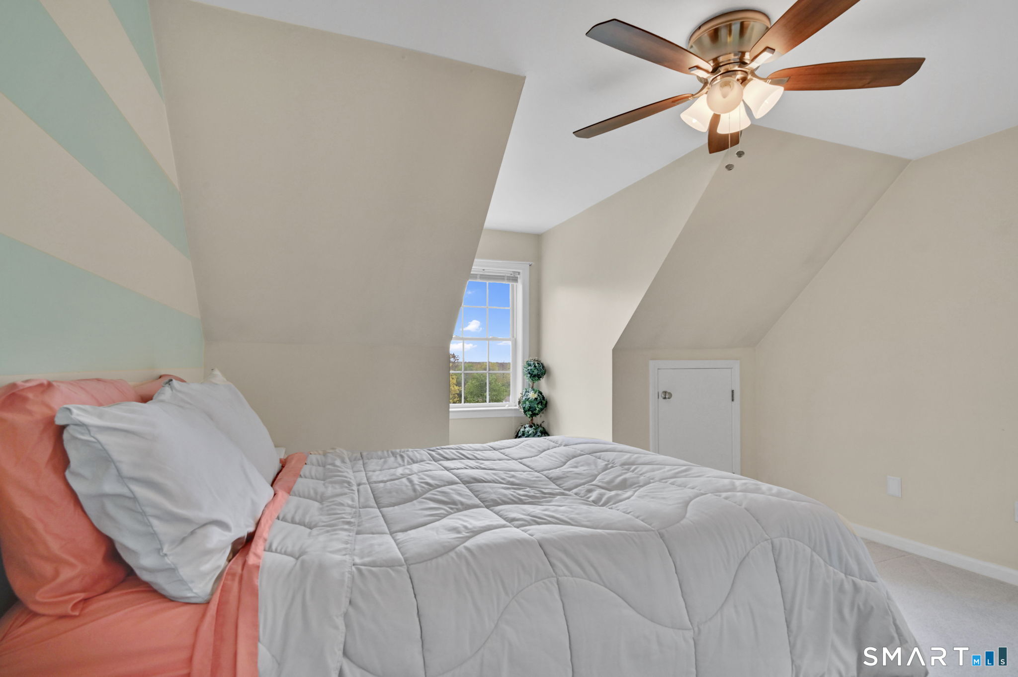 5 Tuckers Run Ledyard, CT 06339 - Photo 28 of 39 a bedroom with a bed and a chandelier