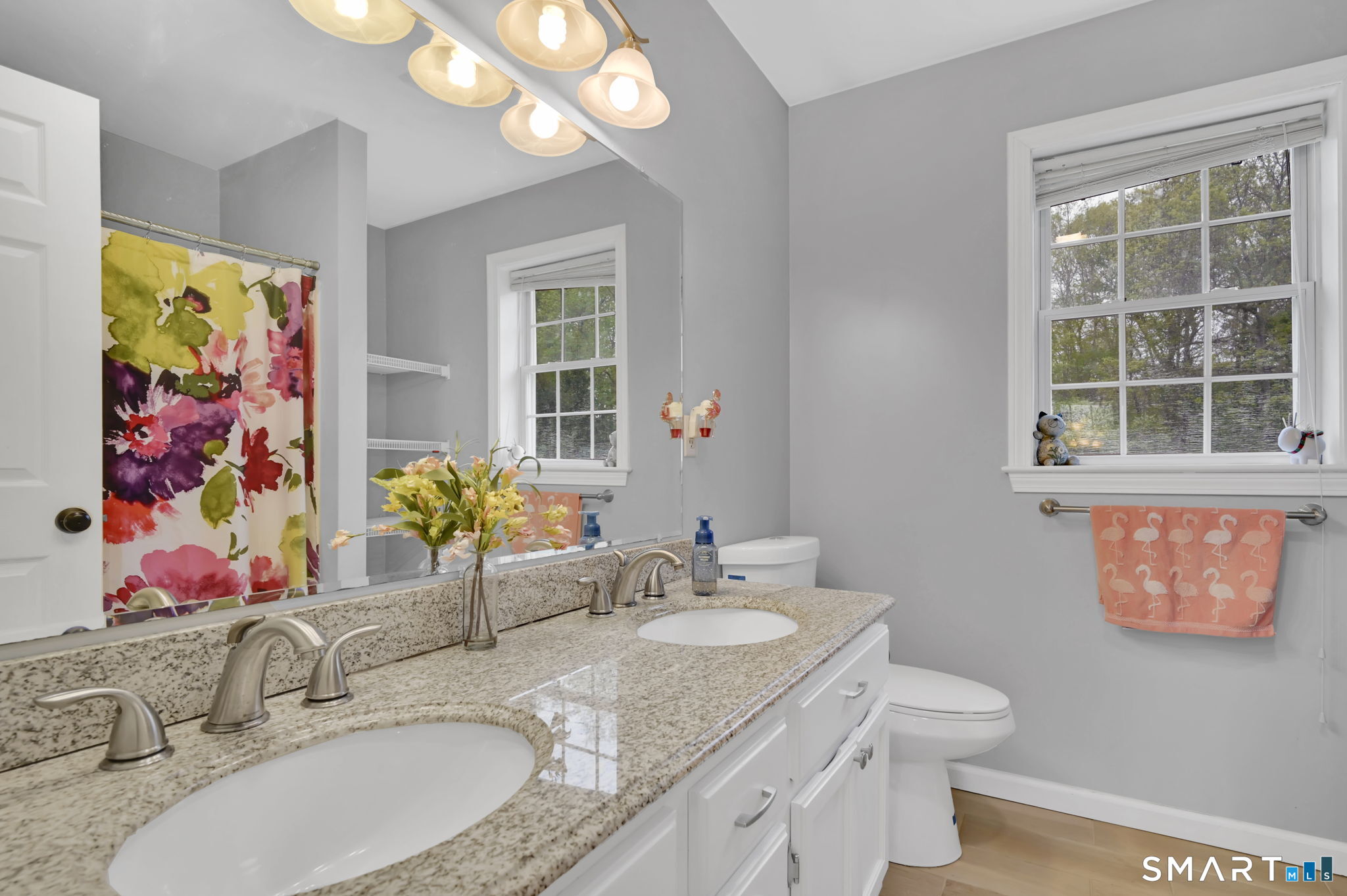 5 Tuckers Run Ledyard, CT 06339 - Photo 30 of 39 a bathroom with a granite countertop sink mirror vanity and a toilet