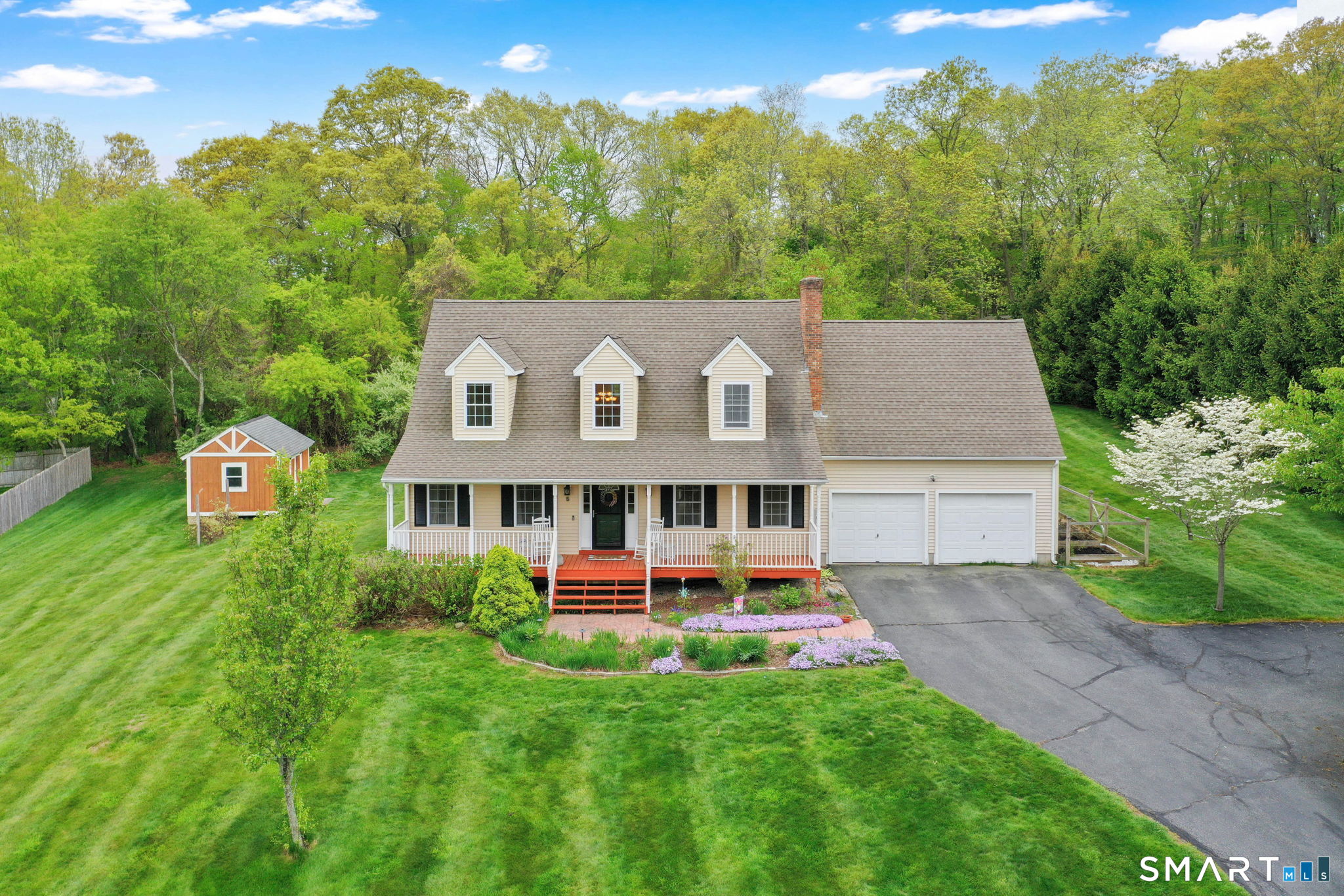 5 Tuckers Run Ledyard, CT 06339 - Photo 4 of 39 a aerial view of a house with swimming pool and garden view