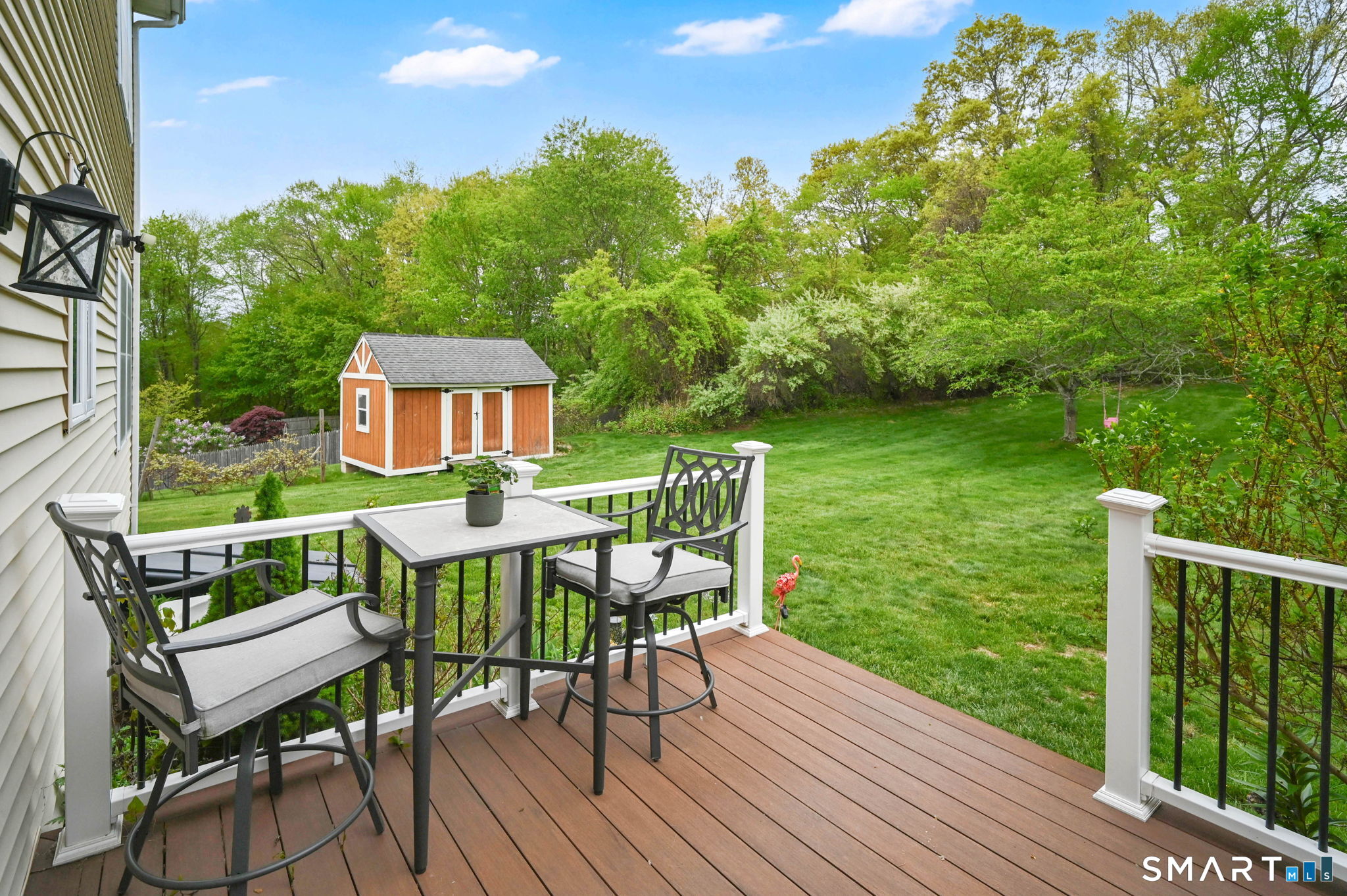 5 Tuckers Run Ledyard, CT 06339 - Photo 7 of 39 a view of a chairs and table on the wooden deck