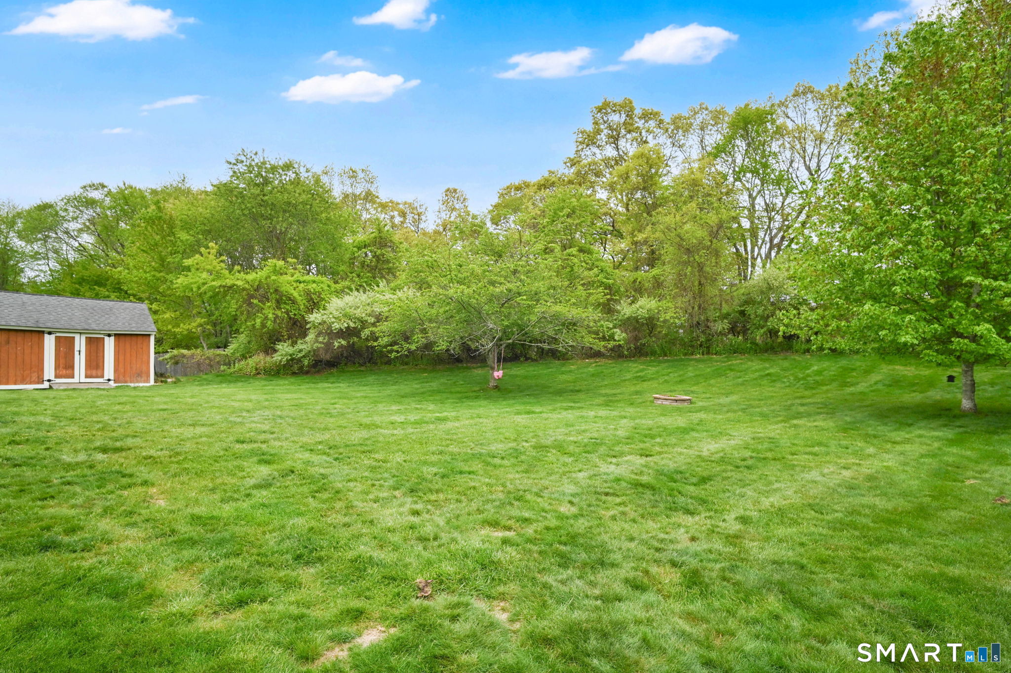 5 Tuckers Run Ledyard, CT 06339 - Photo 8 of 39 a backyard of a house with lots of green space