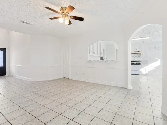 a view of a kitchen with white cabinets