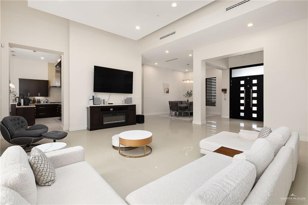 4401 South L Street McAllen, TX 78503 - Photo 3 of 20 a living room with furniture and a flat screen tv