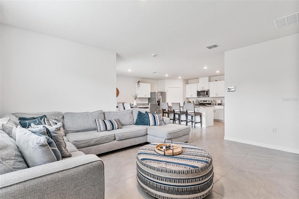 511 Baroness Way DeLand, FL 32724 - Photo 13 of 37 a living room with furniture and a wooden floor