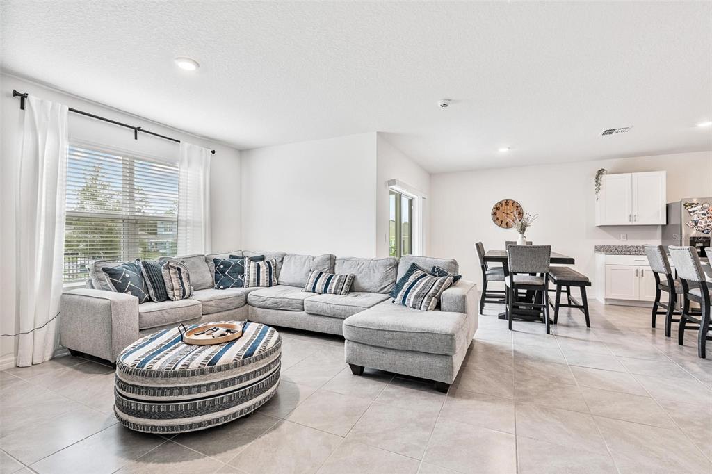 511 Baroness Way DeLand, FL 32724 - Photo 14 of 37 a living room with furniture and a large window