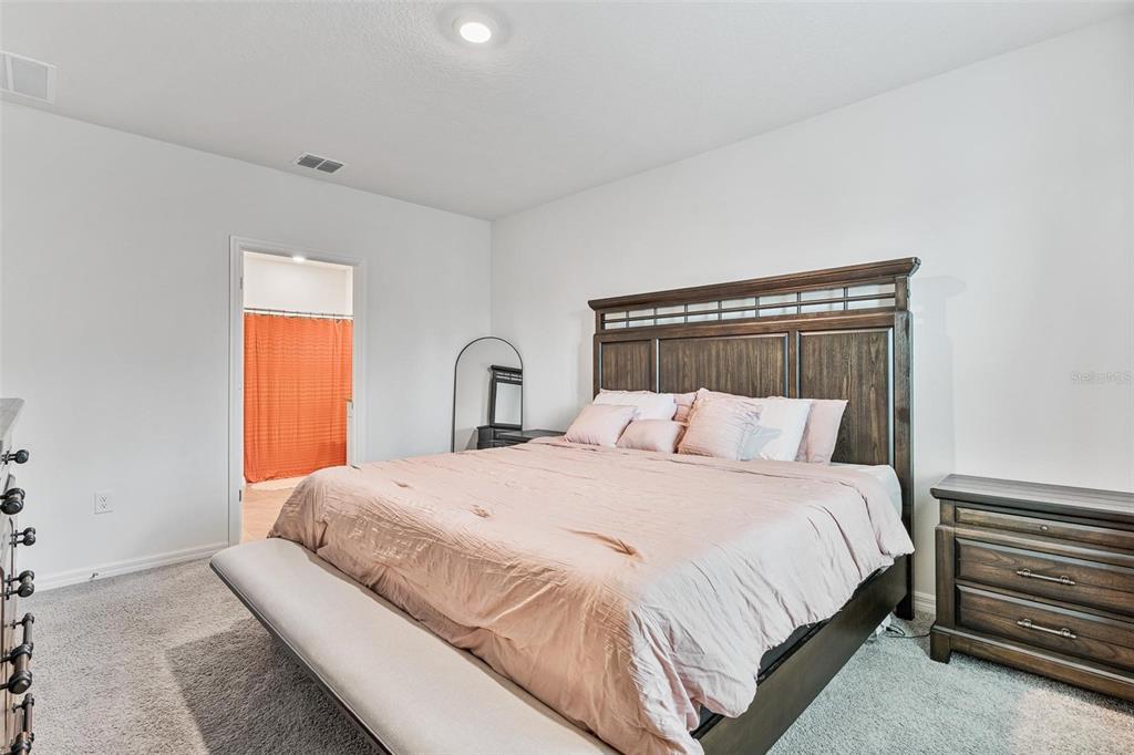 511 Baroness Way DeLand, FL 32724 - Photo 17 of 37 a bedroom with a bed and a window