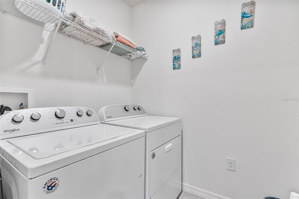 511 Baroness Way DeLand, FL 32724 - Photo 27 of 37 a utility room with dryer and washer
