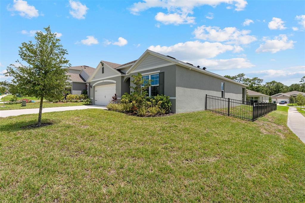 511 Baroness Way DeLand, FL 32724 - Photo 31 of 37 a front view of a house with a yard