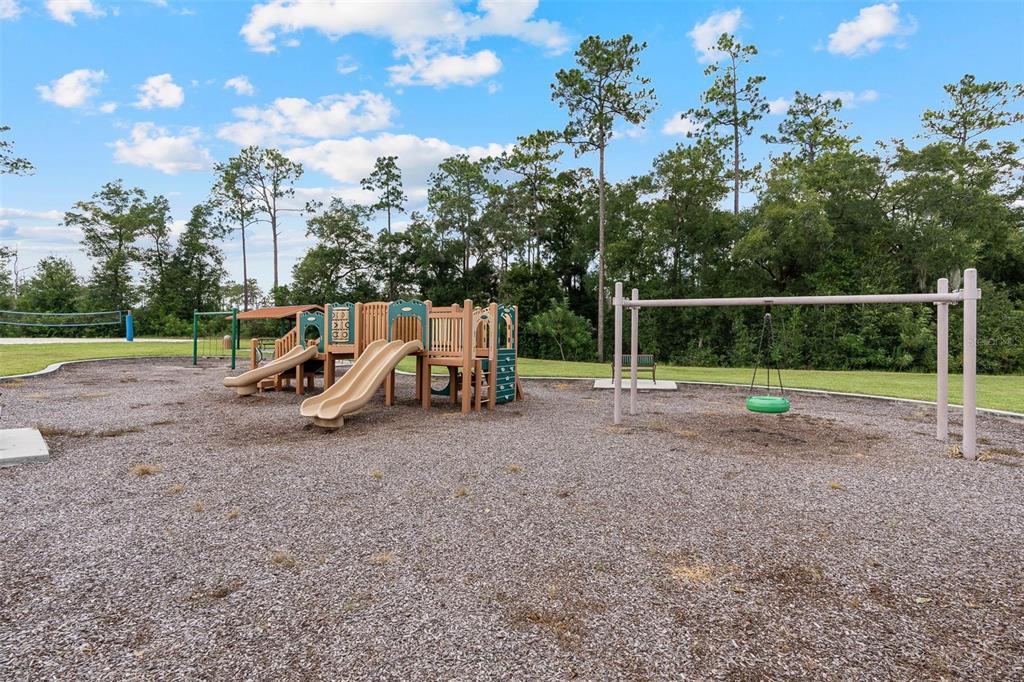 511 Baroness Way DeLand, FL 32724 - Photo 36 of 37 a view of a park with swings and slides