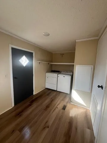 a view of a livingroom with wooden floor