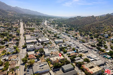 an aerial view of residential house and green space