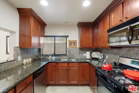 a living room with furniture kitchen view and a table