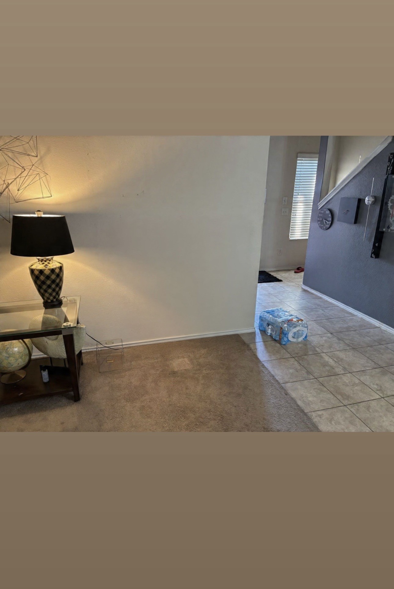 9534 Brandon Rock Lane Houston, TX 77044 - Photo 2 of 7 a living room with furniture and a lamp