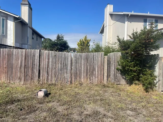 a view of a wooden fence