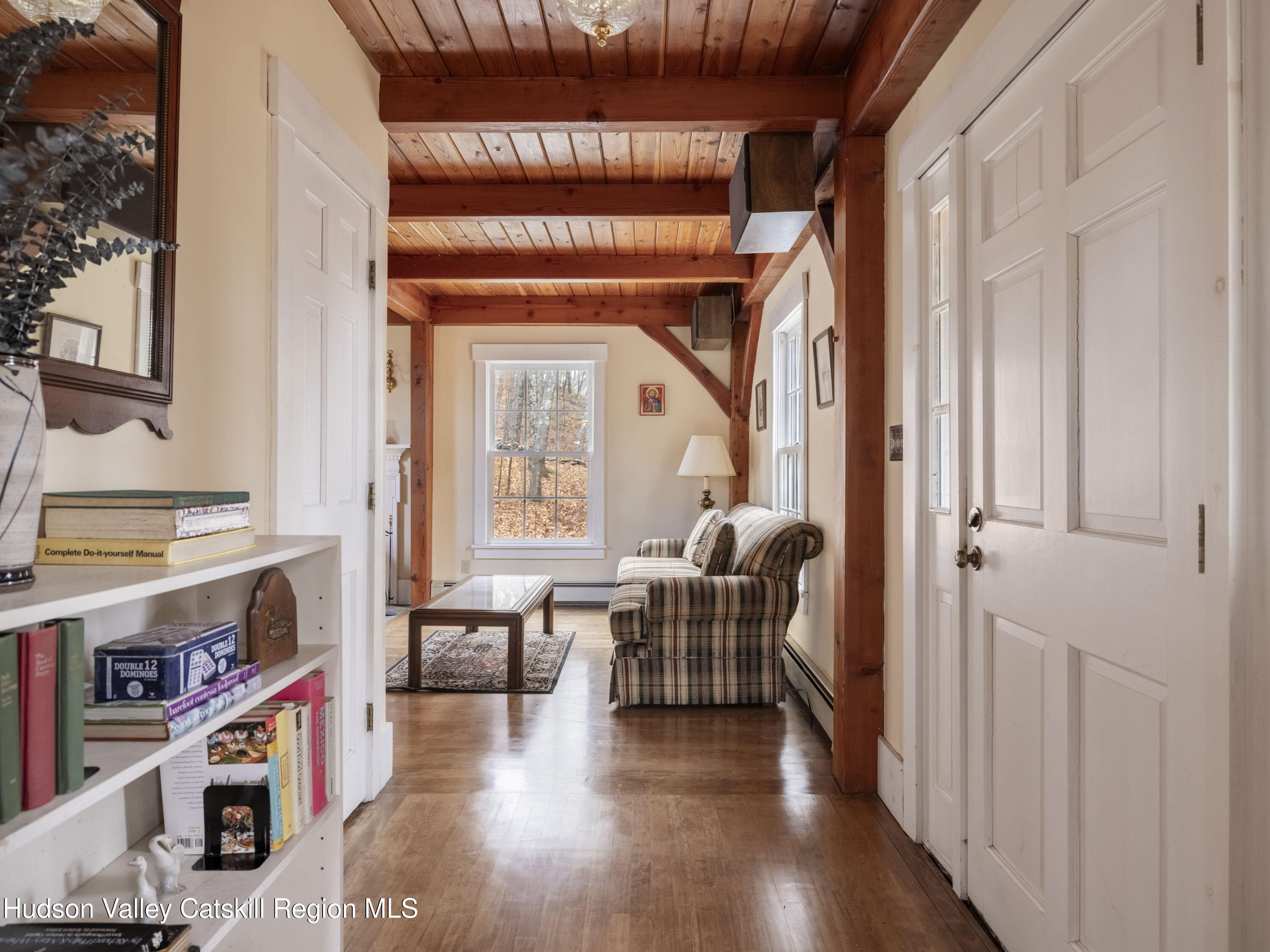 216 Starbarrack Road Red Hook, NY 12571 - Photo 11 of 45 a view of a hallway with wooden floor and furniture