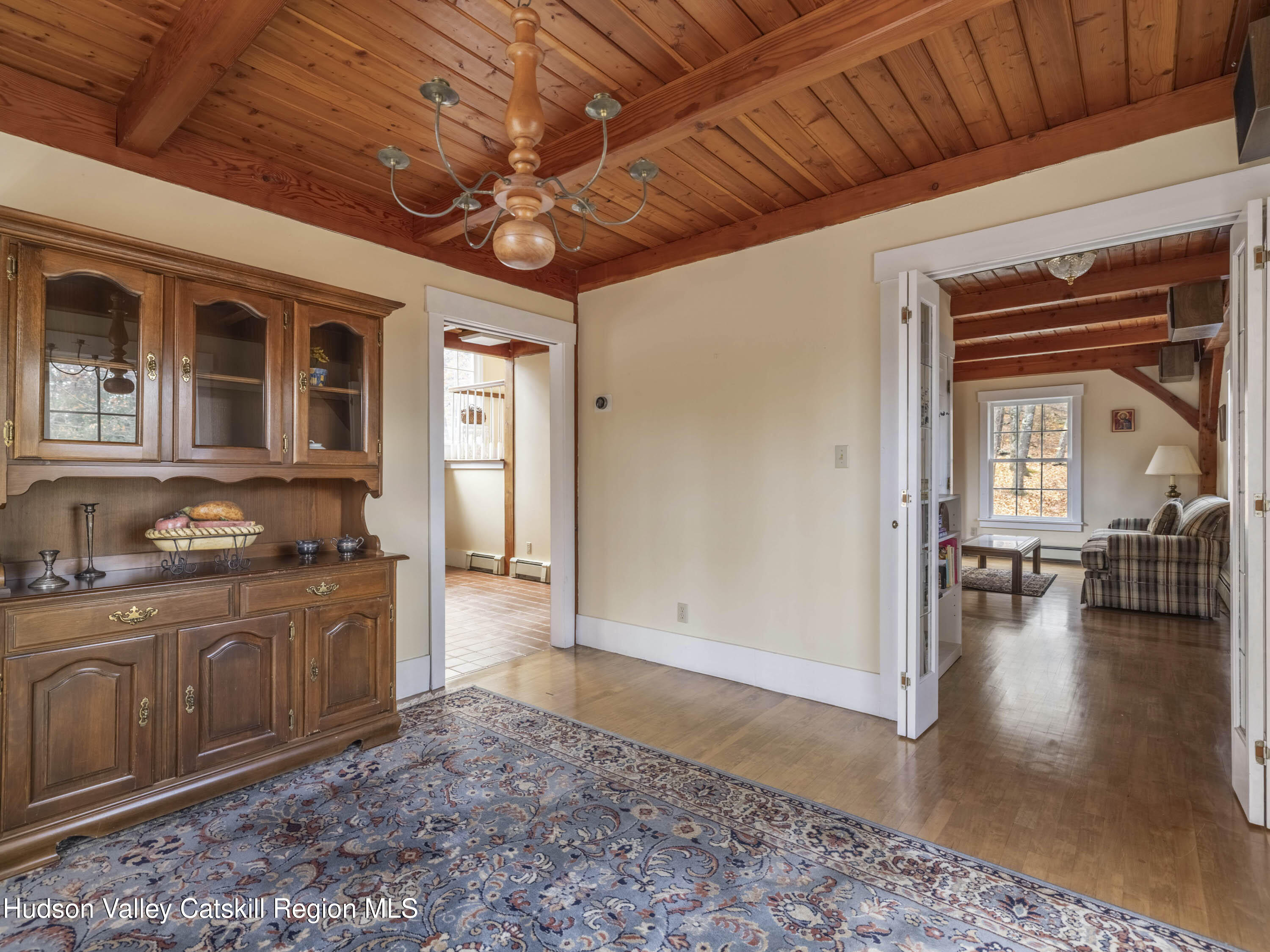216 Starbarrack Road Red Hook, NY 12571 - Photo 12 of 45 a large room with wooden floor and furniture