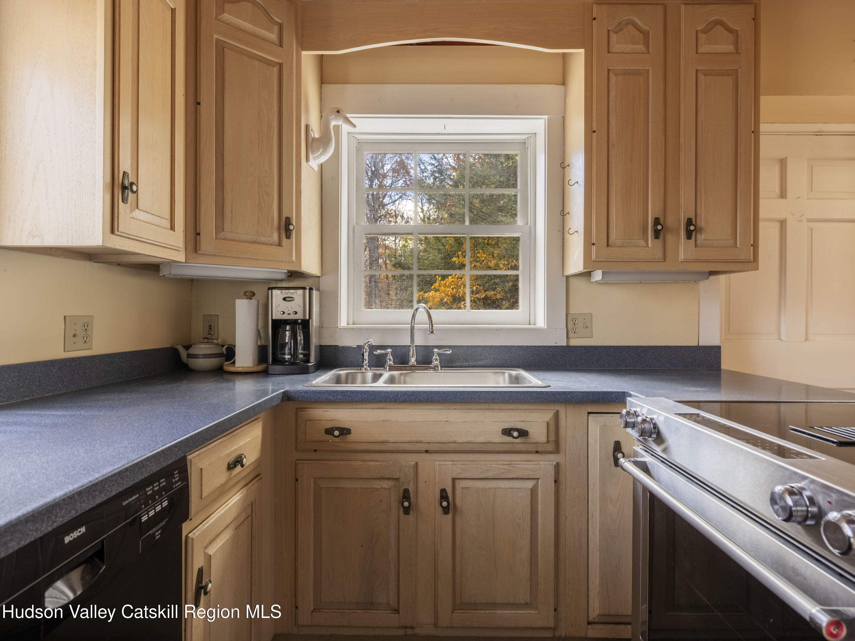 216 Starbarrack Road Red Hook, NY 12571 - Photo 18 of 45 a kitchen with granite countertop a sink stainless steel appliances white cabinets and a window