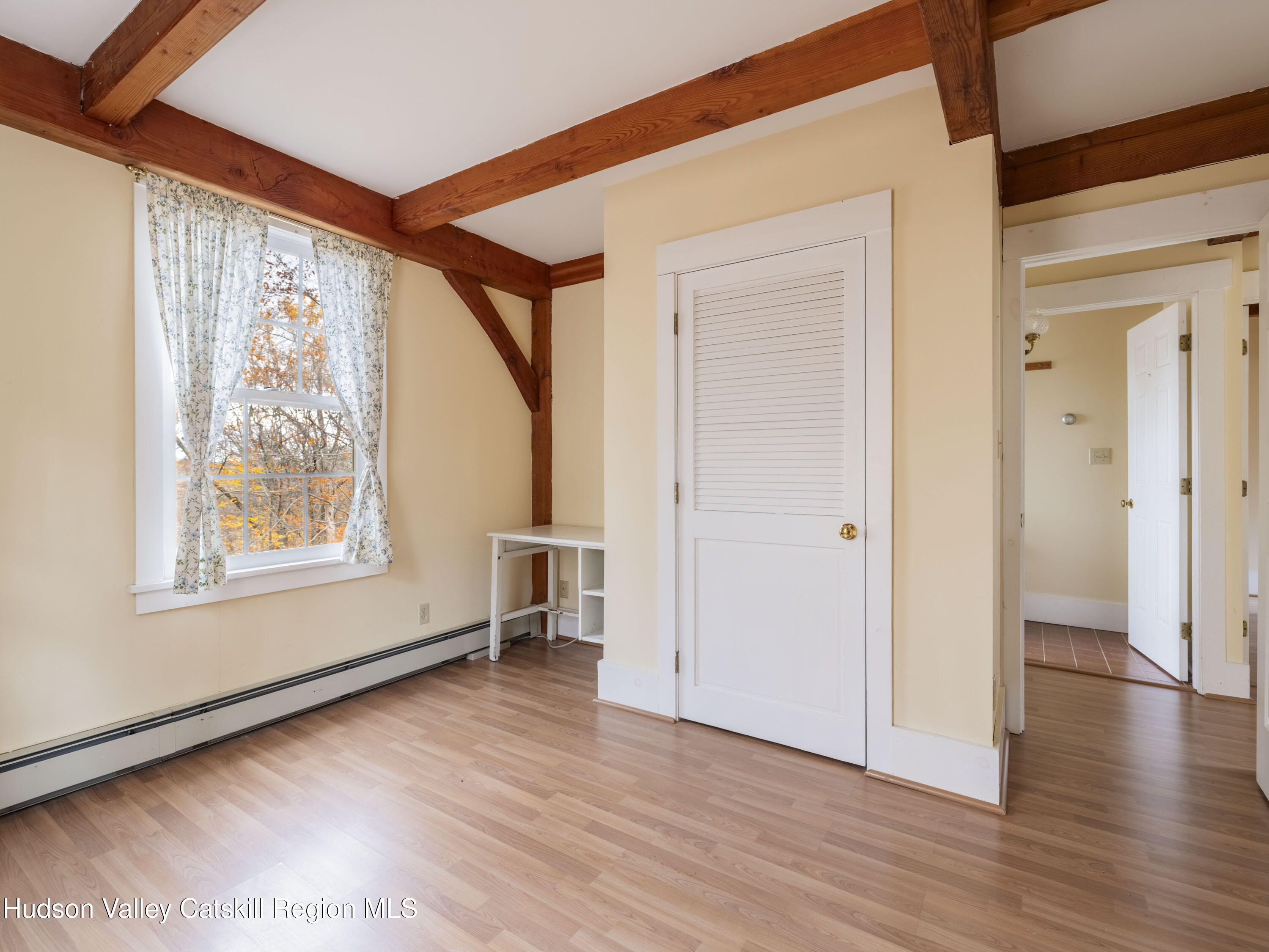 216 Starbarrack Road Red Hook, NY 12571 - Photo 28 of 45 a view of a hallway with wooden floor and a living room