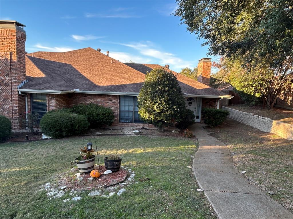a view of a house with backyard sitting area and swimming pool