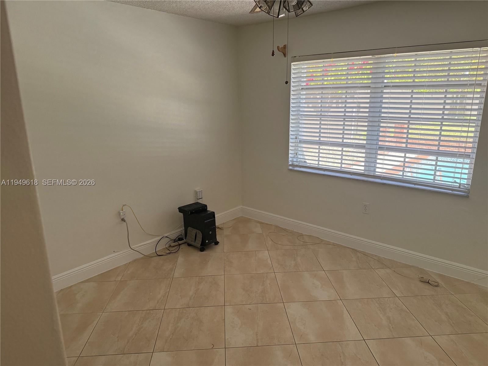 2431 Southwest 124th Avenue Miami, FL 33175 - Photo 13 of 20 a view of an empty room with a window