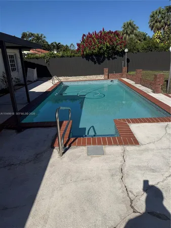 a view of a backyard with seating area