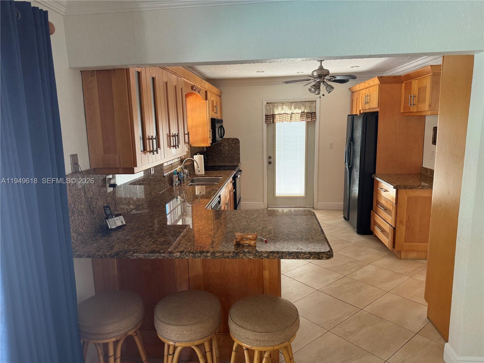 2431 Southwest 124th Avenue Miami, FL 33175 - Photo 10 of 20 a room with chairs a table and chairs