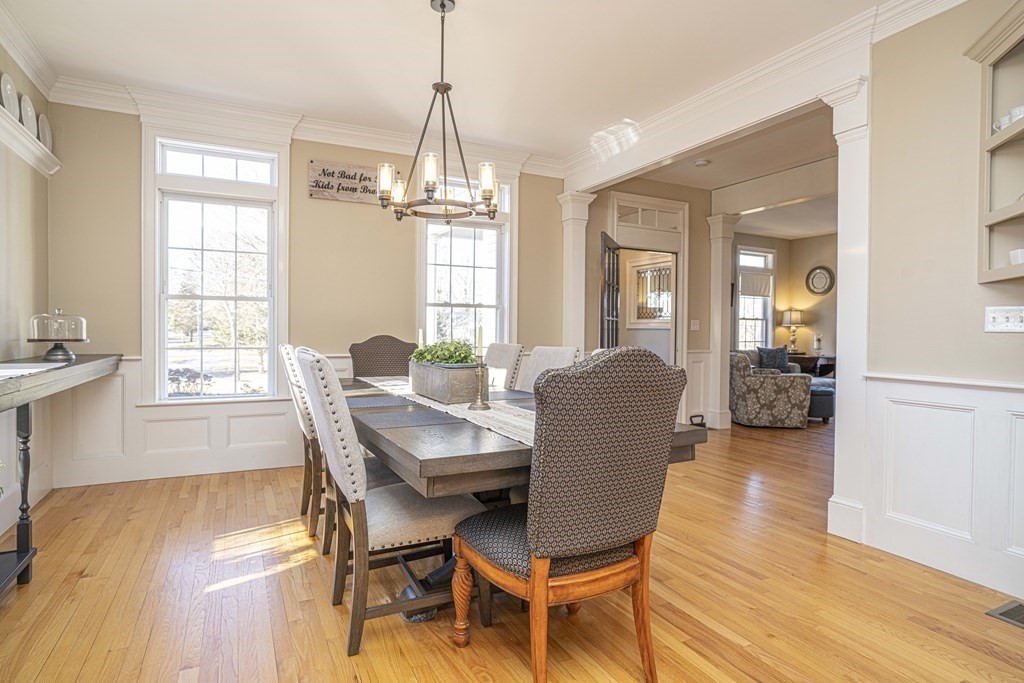 744 Berkley Street Berkley, MA 02779 - Photo 12 of 41 a dining room with furniture a chandelier and wooden floor