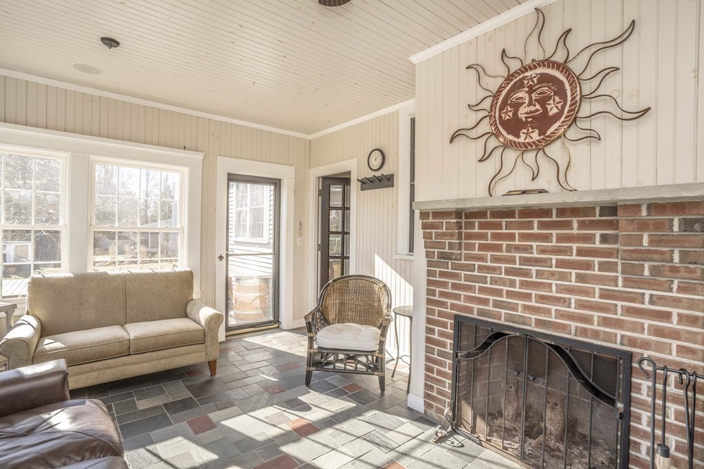 744 Berkley Street Berkley, MA 02779 - Photo 18 of 41 a living room with furniture and a fireplace