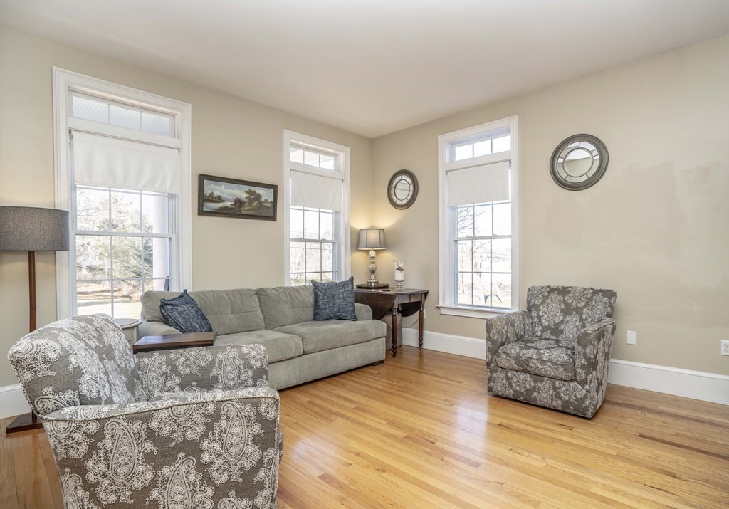 744 Berkley Street Berkley, MA 02779 - Photo 19 of 41 a living room with furniture and a large window