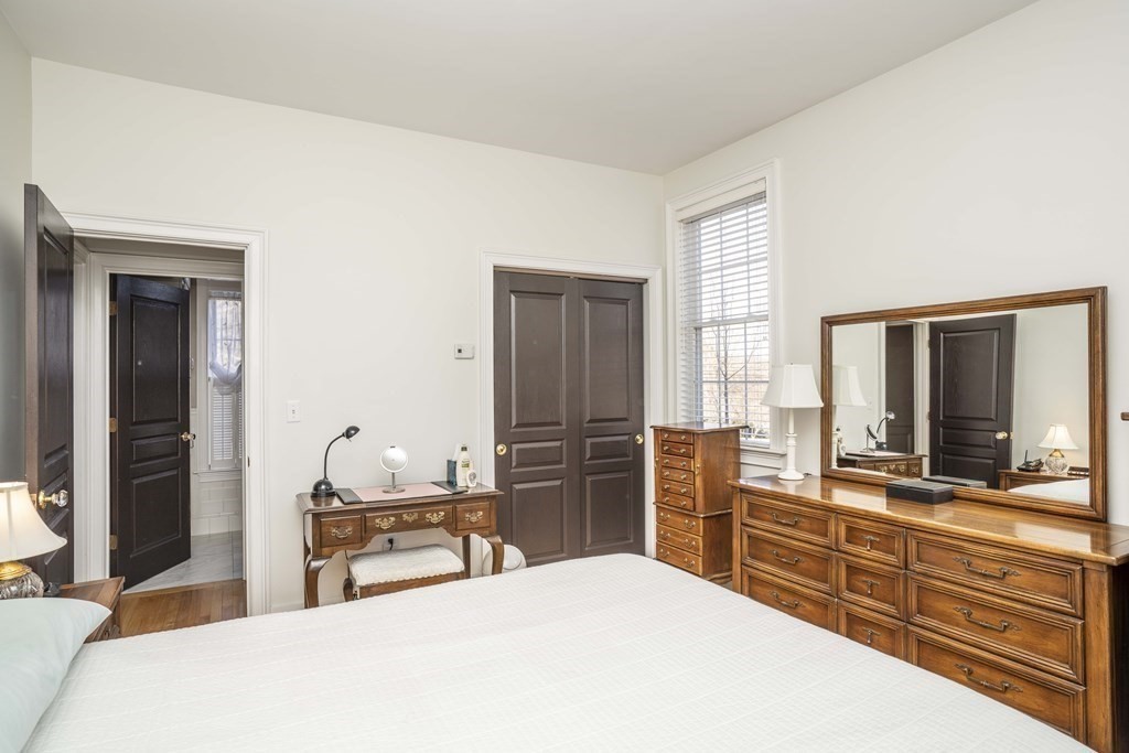 744 Berkley Street Berkley, MA 02779 - Photo 21 of 41 a bedroom with a bed and large windows