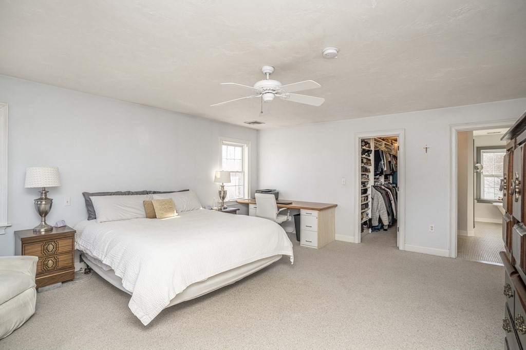 744 Berkley Street Berkley, MA 02779 - Photo 26 of 41 a bedroom with a bed and a chandelier