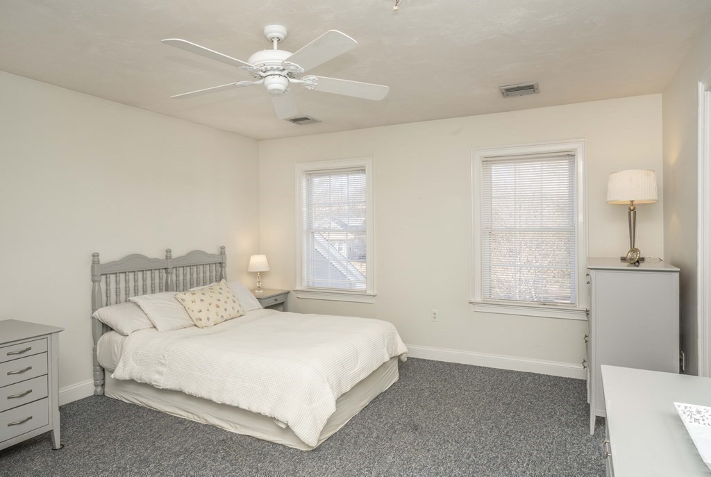 744 Berkley Street Berkley, MA 02779 - Photo 33 of 41 a bedroom with a white bed and a window