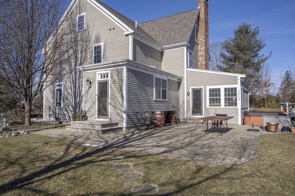 744 Berkley Street Berkley, MA 02779 - Photo 35 of 41 a bench is sitting in front of a house