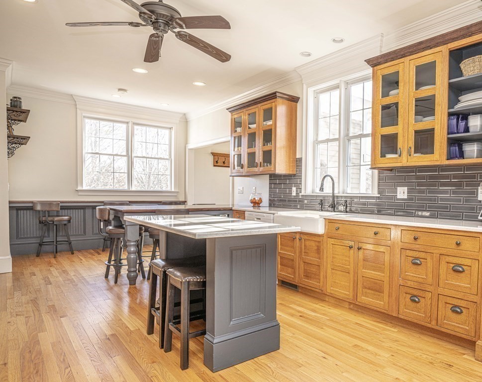 744 Berkley Street Berkley, MA 02779 - Photo 6 of 41 a large kitchen with stainless steel appliances granite countertop a stove and a wooden floors