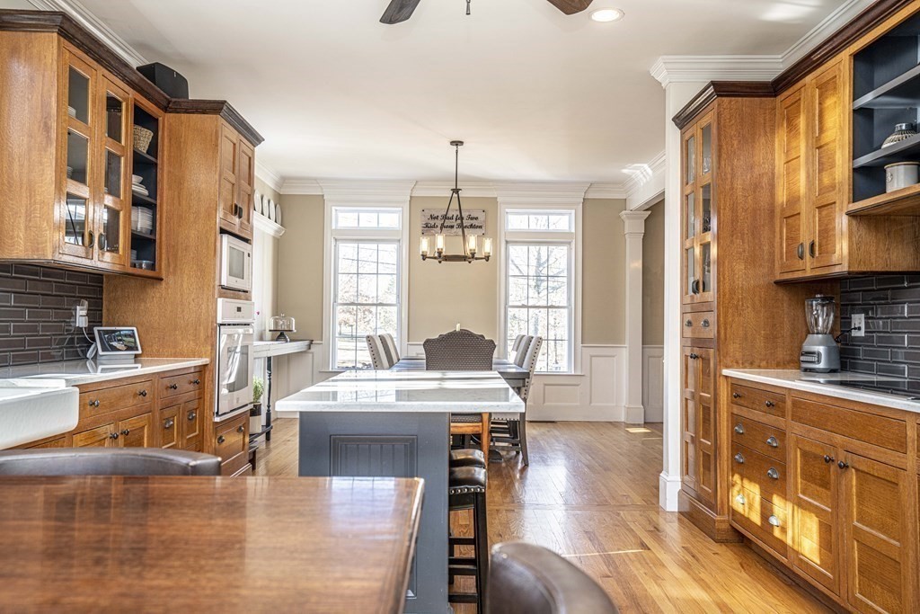 744 Berkley Street Berkley, MA 02779 - Photo 8 of 41 a living room with stainless steel appliances furniture a rug and a kitchen view